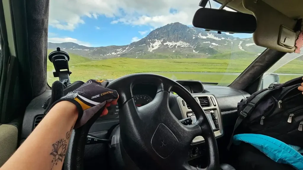 Adventurers exploring Mount Aragats by off-road vehicle