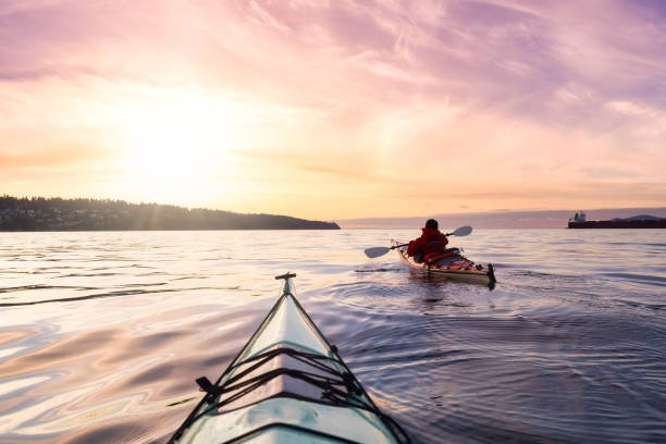 Adventurous Man Sea Kayaking in the sevan lake in armenia