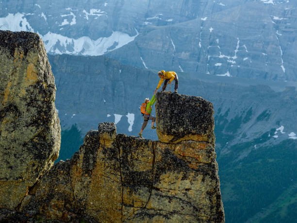 Snowcapped mountain behind them during rock claiming