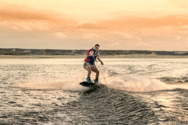 Wakeboarding, extreme aquatic sport.
