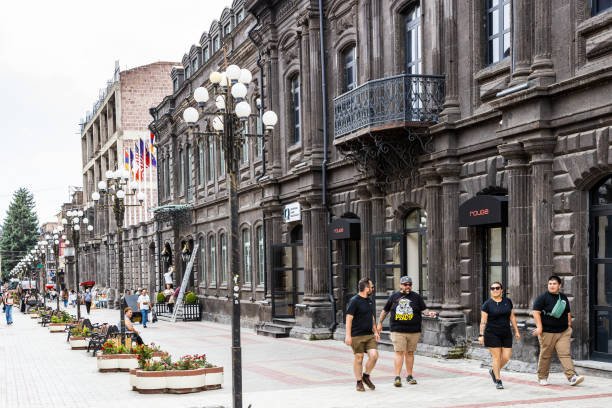 Gyumri, Armenia - July 19, 2024: tourists on Abovyan Walking Street in old town of Gyumri city on overcast summer day