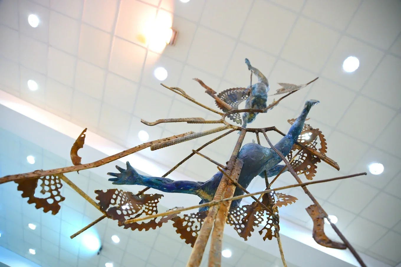 Visitors exploring a modern art exhibition at the Artists Union of Armenia.